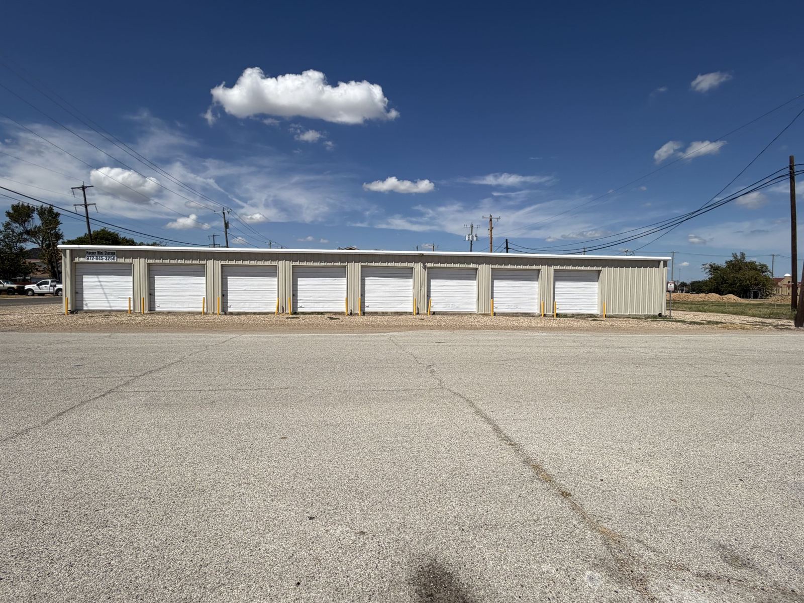 Harper Mini Storage building with company sign and phone number